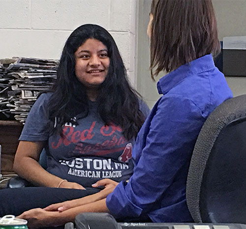 Passing it on: Daily Dispatch reporter Allison Tretina shares some of her knowledge and experience with Durham high school student and VOICE staff writer Diana Lopez. (Jock Lauterer photo)
